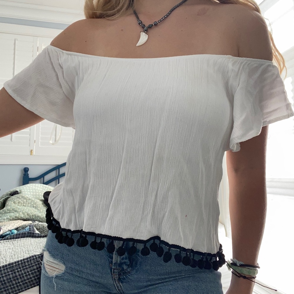 white off the shoulder blouse w black pom poms